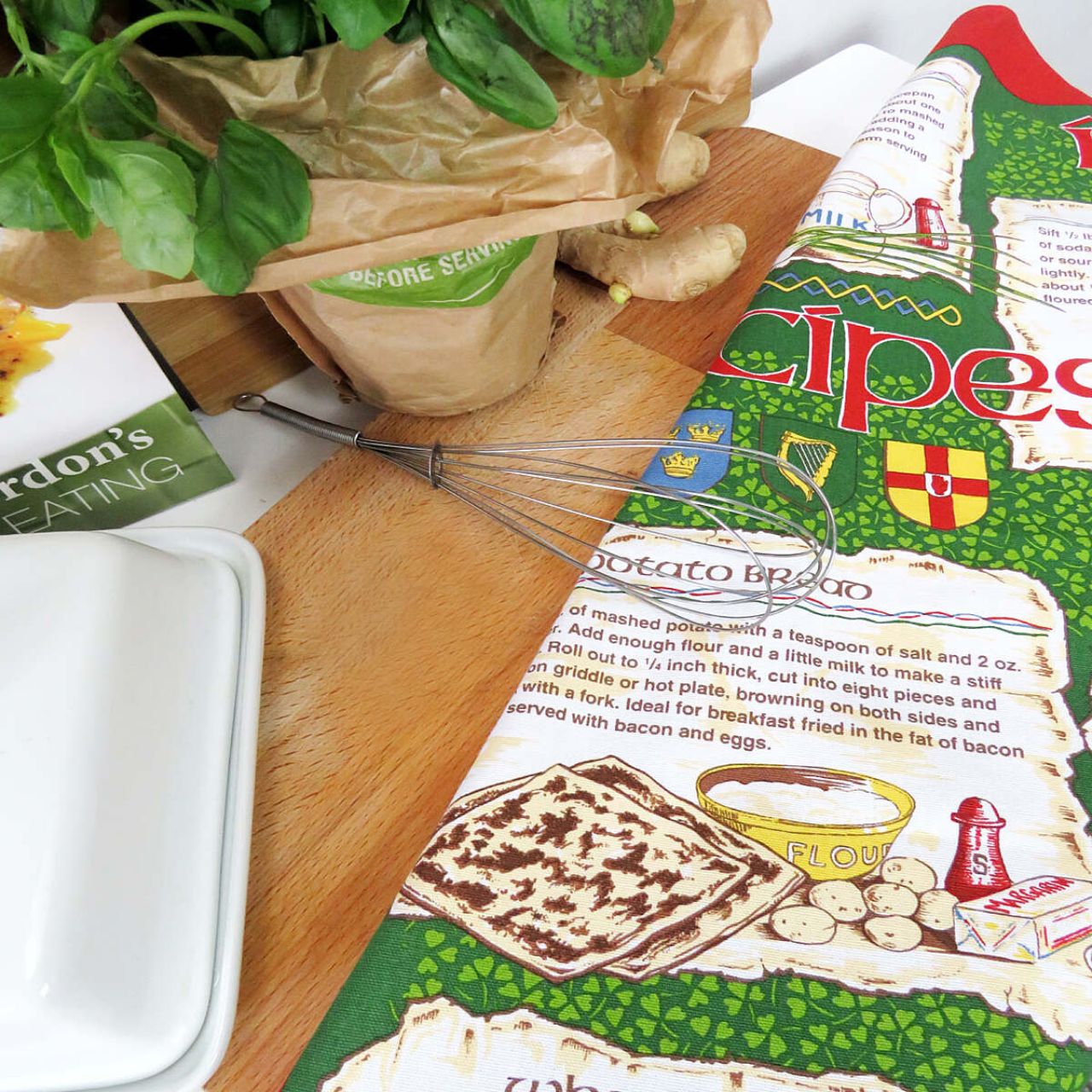 A traditional Irish tea towel inheriting a variety of well known Irish recipes. A beautiful Irish souvenir with vibrant red and green tones, including hand drawn and written motifs. Read easily whilst you cook with it's practical easy hang loop!