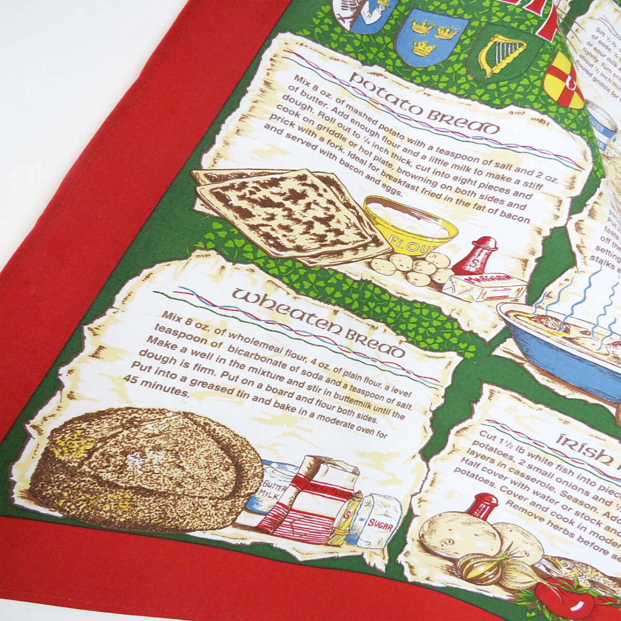 A traditional Irish tea towel inheriting a variety of well known Irish recipes. A beautiful Irish souvenir with vibrant red and green tones, including hand drawn and written motifs. Read easily whilst you cook with it's practical easy hang loop!