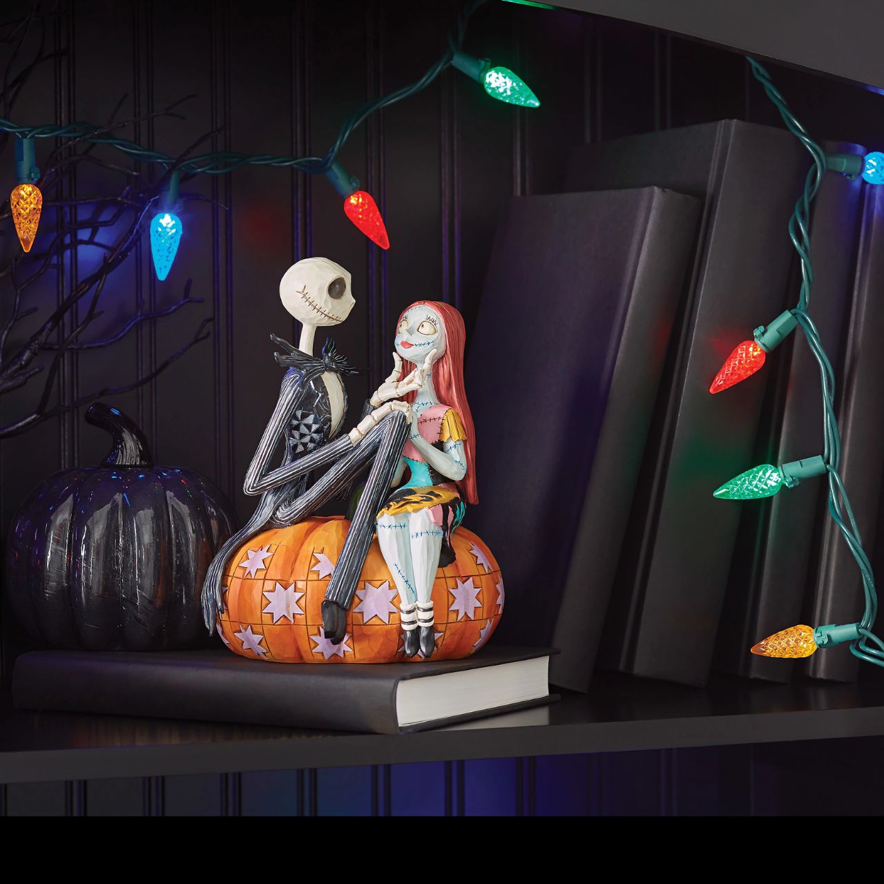 Jack and Sally sit atop a pumpkin in this Halloween themed figurine. The perfect gift for any Nightmare before Christmas fans or happy couples who love all things spooky. Designed by Jim Shore. Hand painted and hand carved. Comes in fully branded gift box.