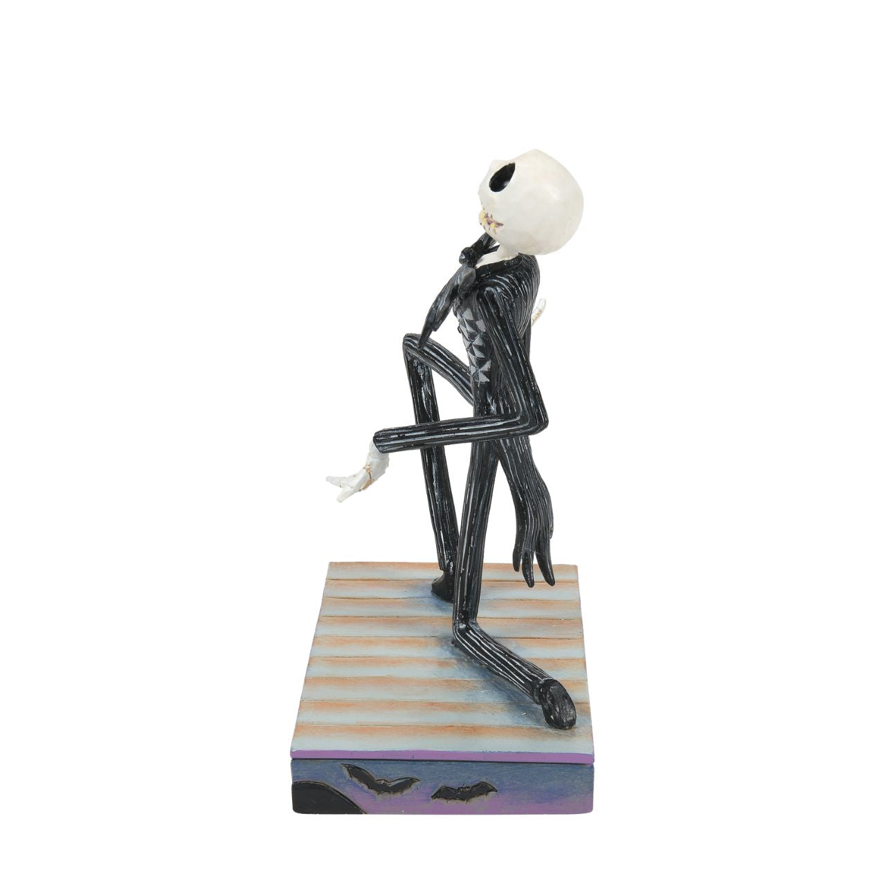 Jack Skellington Personality Pose Figurine  Jack Skellington is down on one knee and looks delighted. in his iconic black and white stripe suit and Bat bow-tie, he is on a Halloween themed base, even featuring a Jack-O-Lantern peeking out of the corner. Designed by Jim Shore for the Disney Traditions collection, this is the perfect Nightmare Before Christmas piece for any fan.