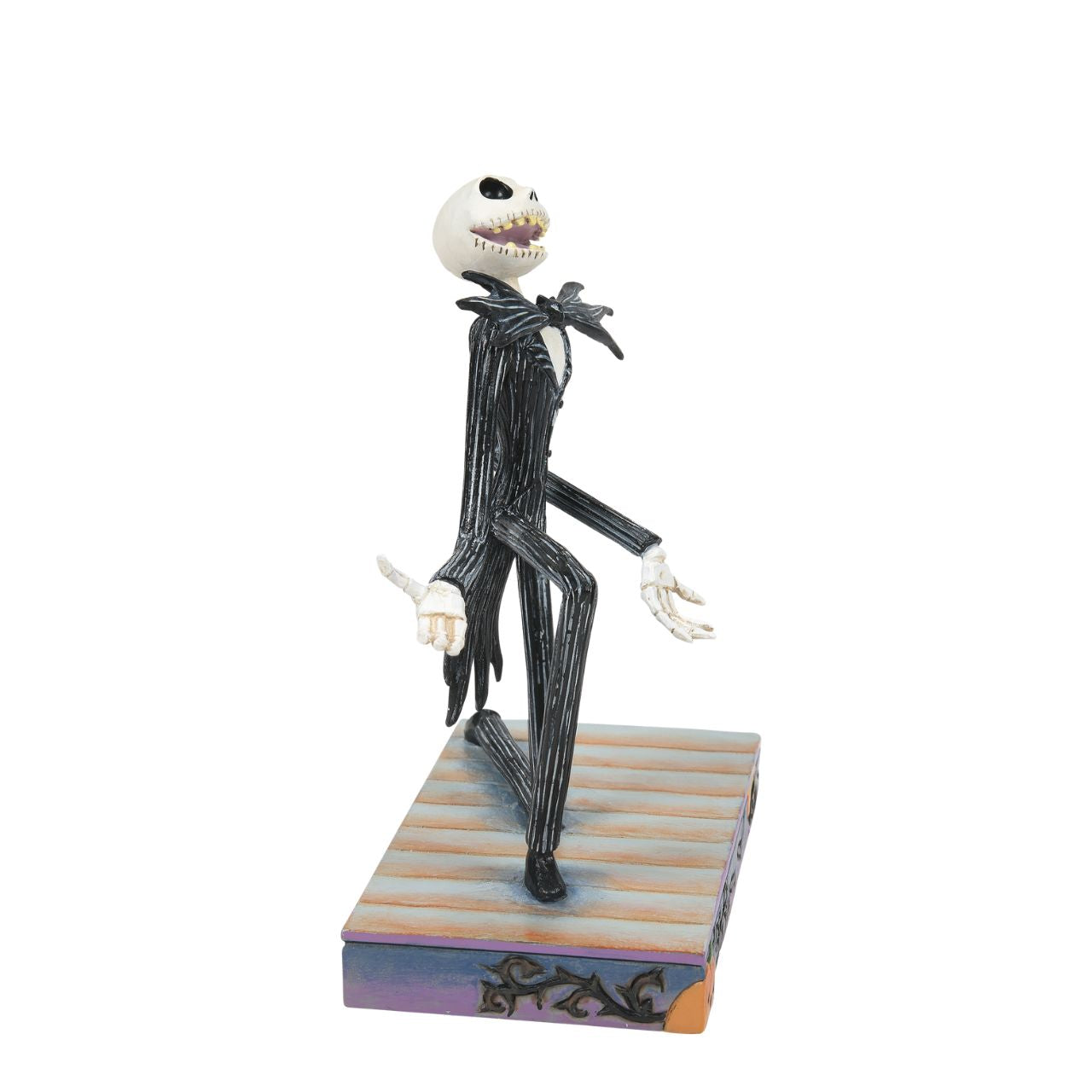 Jack Skellington Personality Pose Figurine  Jack Skellington is down on one knee and looks delighted. in his iconic black and white stripe suit and Bat bow-tie, he is on a Halloween themed base, even featuring a Jack-O-Lantern peeking out of the corner. Designed by Jim Shore for the Disney Traditions collection, this is the perfect Nightmare Before Christmas piece for any fan.