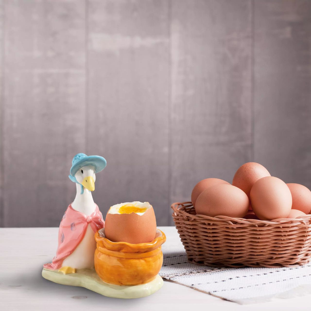 Serve your morning eggs in style with our unique and charming Jemima Puddle-duck egg cup, because regular egg cups aren't all they're cracked up to be... This beautiful Beatrix Potter egg cup has been made from sturdy ceramic and makes the ideal collector's piece or gift. We recommend you use large eggs to feel the true benefit, or why not fill with mini chocolate eggs for a sweet easter gift. 