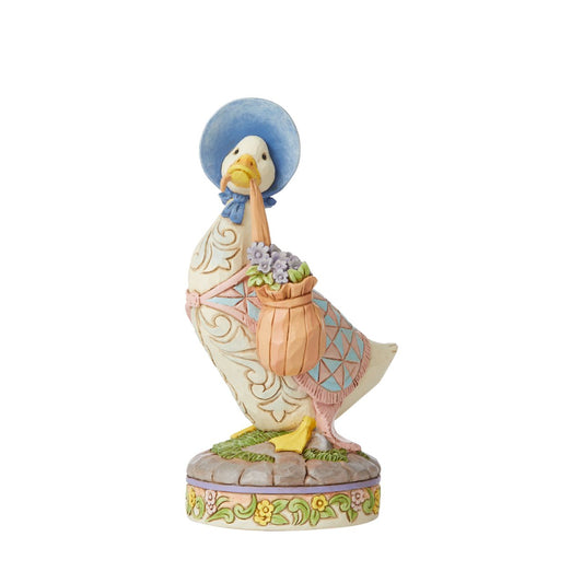 Jim Shore Jemima Puddle-Duck Wearing a Shawl and a Poke Bonnet  Award winning folk artist Jim Shore brings his unique style to Beatrix Potter's beloved story, The Tale of Peter Rabbit, through charming hand-crafted gifts that will delight her readers of all ages. This Jim Shore figurine features Jemima Puddle-Duck, wearing her shawl and poke bonnet.