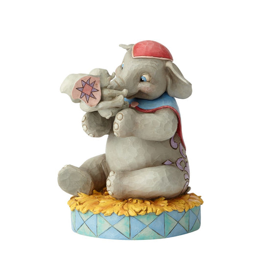 Disney Mrs Jumbo and Dumbo Figurine A Mother's Unconditional Love by Jim Shore  Fiercely protective and unconditionally loving, Mrs. Jumbo cherishes her big-eared baby Dumbo. Handcrafted and hand-painted in exquisite detail, this cast stone figurine by Jim Shore makes a beautiful keepsake for Mother's Day or as a new mum gift.