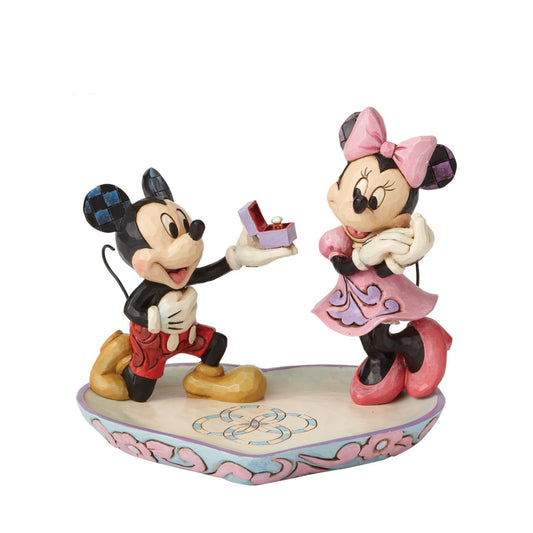 Mickey Mouse is the soul of romance as he proposes to a love-struck Minnie Mouse in this heartfelt design featuring the artistry of Jim Shore. The figurine is made from cast stone. It will also make a perfect ring tray for when you pop the question yourself or will add some Disney love to your own jewellery.