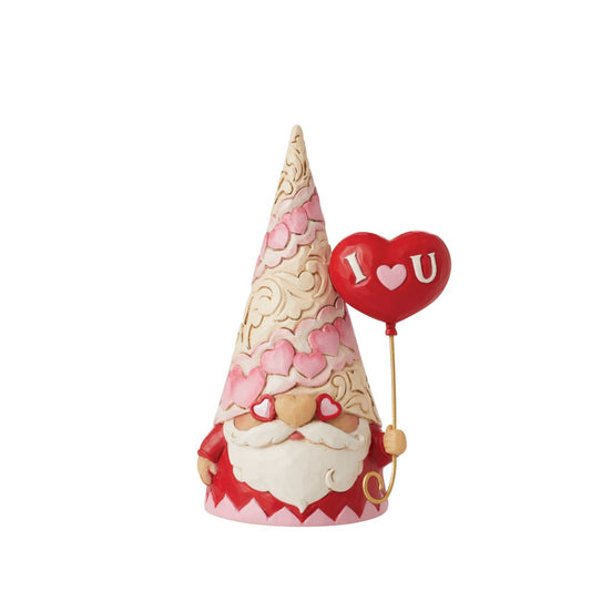 This colourful gnome by Jim Shore celebrates Valentine's Day with a hat full of hearts and an I love you balloon. In pink and red hues, he invites affection with pink rosemaling and sentimental detail. This inviting collectible makes a sweet gift.