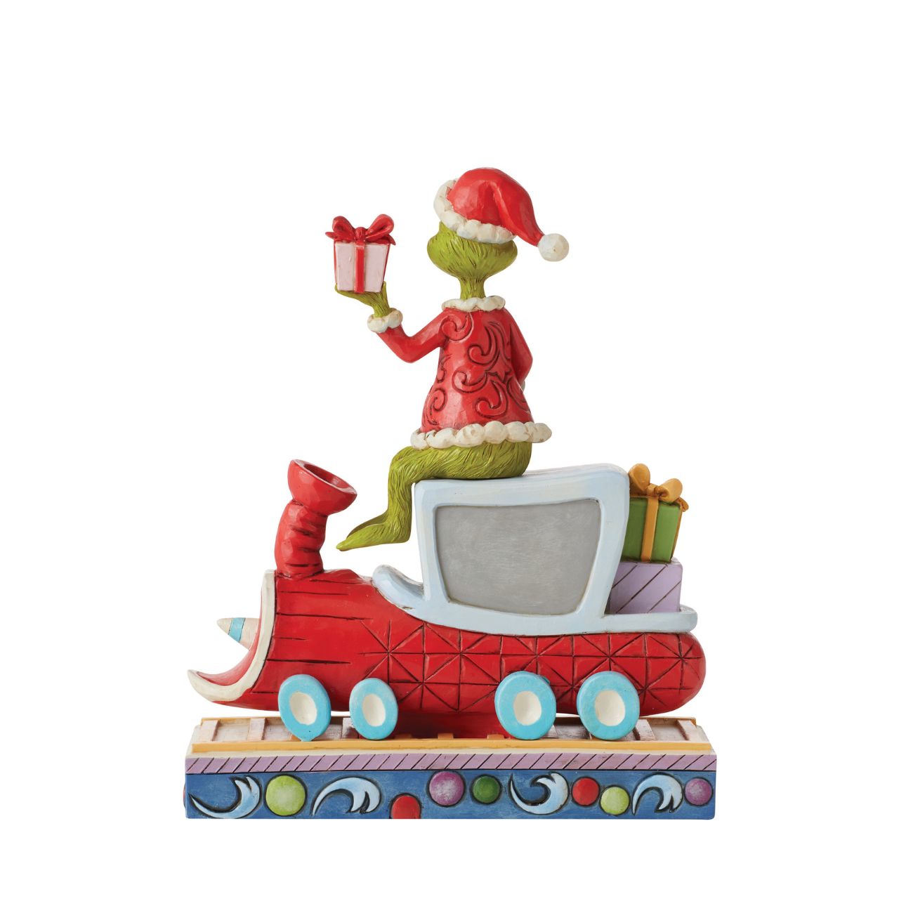 Atop a red train engine bound for Whoville, The Grinch wears a dashing red vest and Santa hat to re-deliver previously stolen presents. Finding kindness in his heart, the greedy Grinch changes his disposition and wears a sincere smile in this Jim Shore collectable.