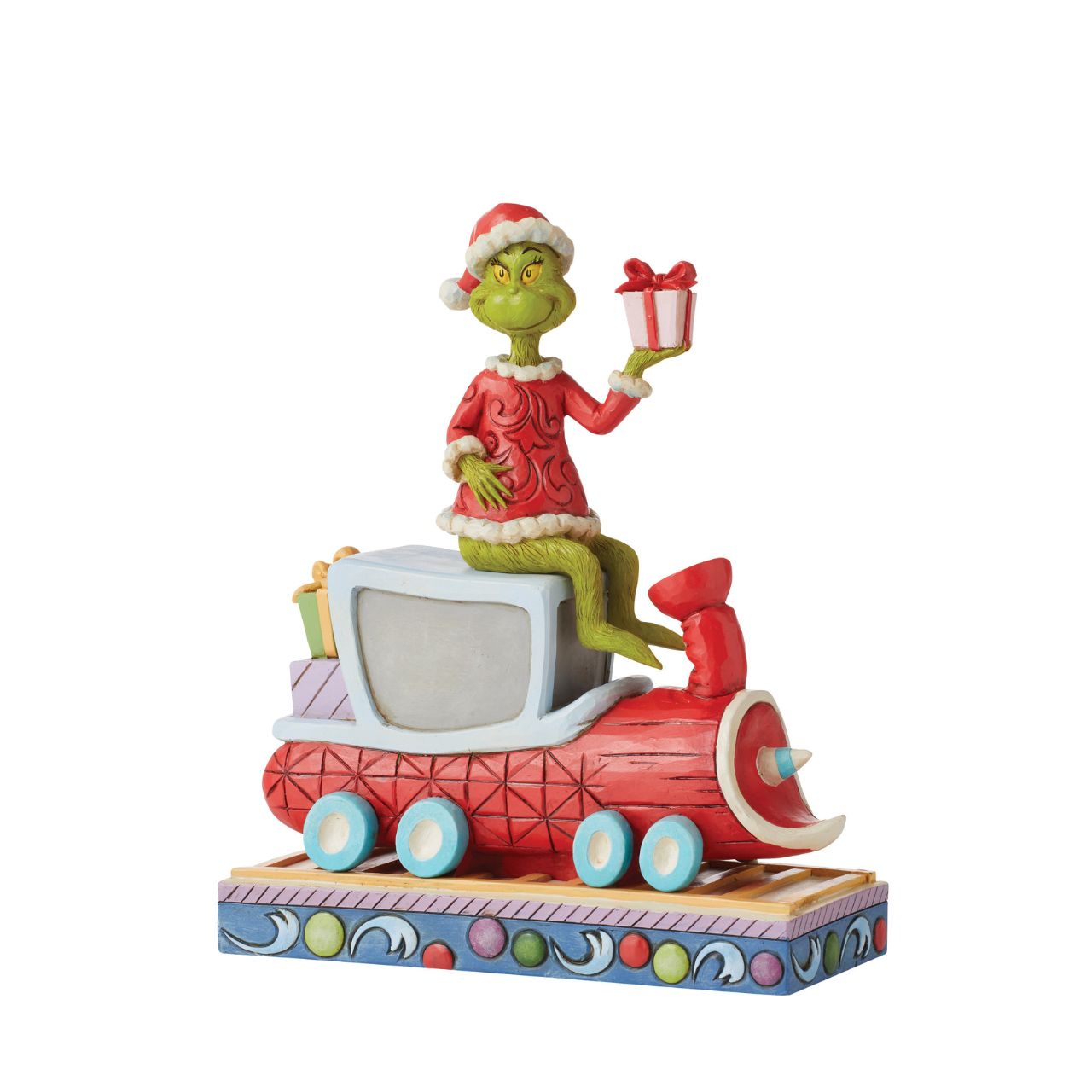 Atop a red train engine bound for Whoville, The Grinch wears a dashing red vest and Santa hat to re-deliver previously stolen presents. Finding kindness in his heart, the greedy Grinch changes his disposition and wears a sincere smile in this Jim Shore collectable.