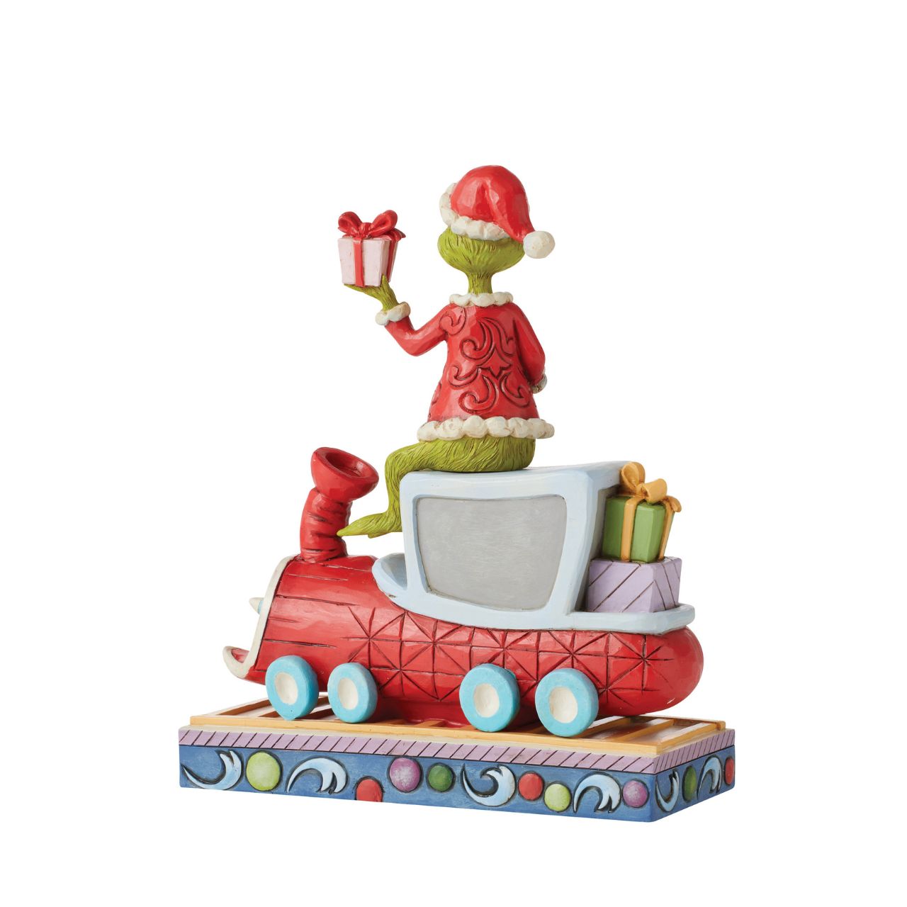 Atop a red train engine bound for Whoville, The Grinch wears a dashing red vest and Santa hat to re-deliver previously stolen presents. Finding kindness in his heart, the greedy Grinch changes his disposition and wears a sincere smile in this Jim Shore collectable.