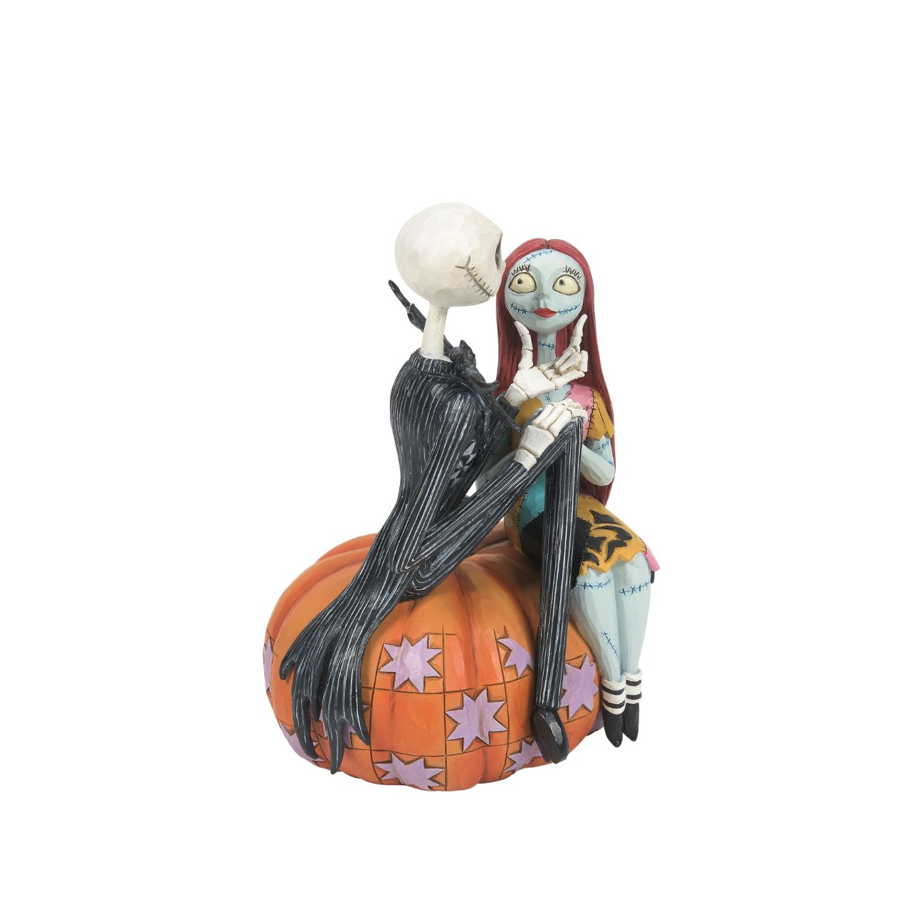 Jack and Sally sit atop a pumpkin in this Halloween themed figurine. The perfect gift for any Nightmare before Christmas fans or happy couples who love all things spooky. Designed by Jim Shore. Hand painted and hand carved. Comes in fully branded gift box.