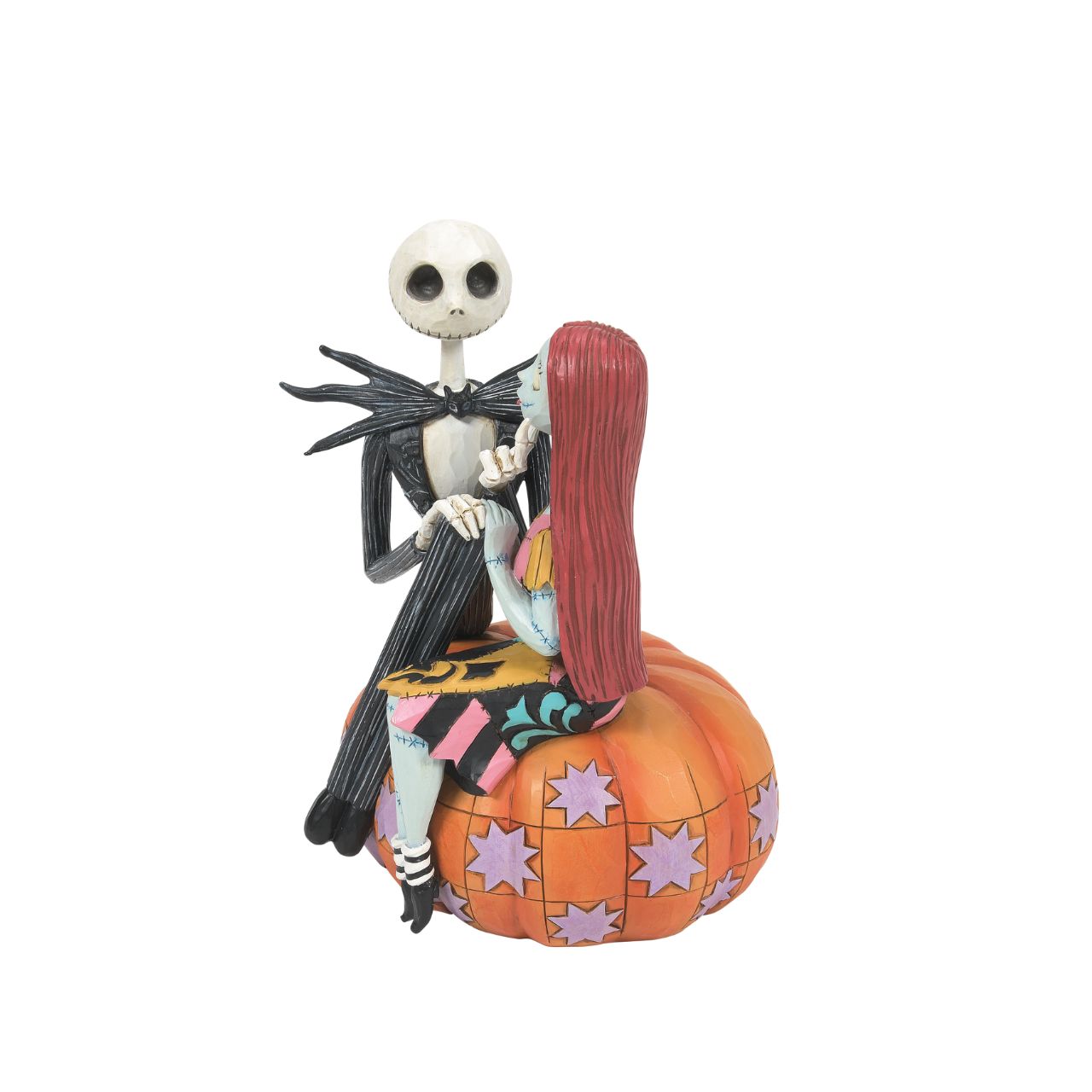 Jack and Sally sit atop a pumpkin in this Halloween themed figurine. The perfect gift for any Nightmare before Christmas fans or happy couples who love all things spooky. Designed by Jim Shore. Hand painted and hand carved. Comes in fully branded gift box.