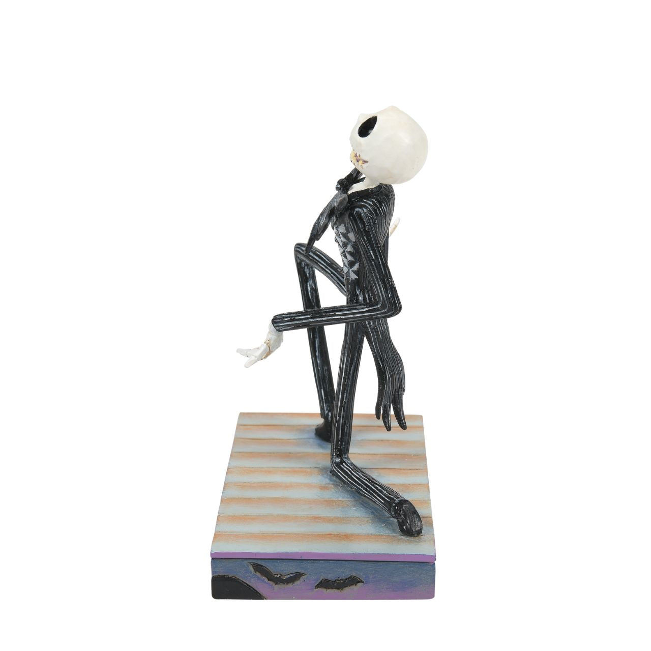 Jack Skellington Personality Pose Figurine  Jack Skellington is down on one knee and looks delighted. in his iconic black and white stripe suit and Bat bow-tie, he is on a Halloween themed base, even featuring a Jack-O-Lantern peeking out of the corner. Designed by Jim Shore for the Disney Traditions collection, this is the perfect Nightmare Before Christmas piece for any fan.