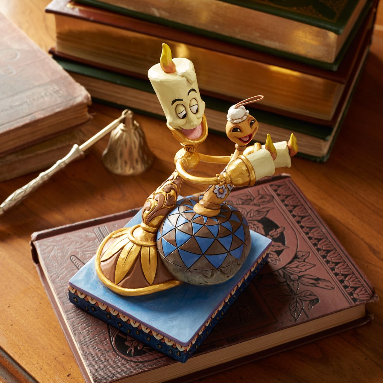 Lumiere is full of love as he holds his girlfriend, Fifi from Disney's Beauty and the Beast. Unique variations should be expected as this product is hand painted. Packed in a branded gift box. Not a toy or children's product. Intended for adults only.