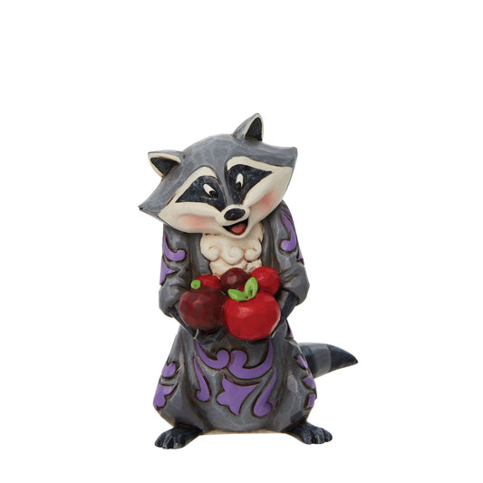 Disney Pocahontas Meeko Mini Figurine by Jim Shore  Meeko, the beloved racoon from Disney's 1995 animated feature film, Pocahontas, loves food, especially John Smith's biscuits. In this Jim Shore miniature, the resourceful scavenger has found a bounty of apples. His face lights up at his snack.