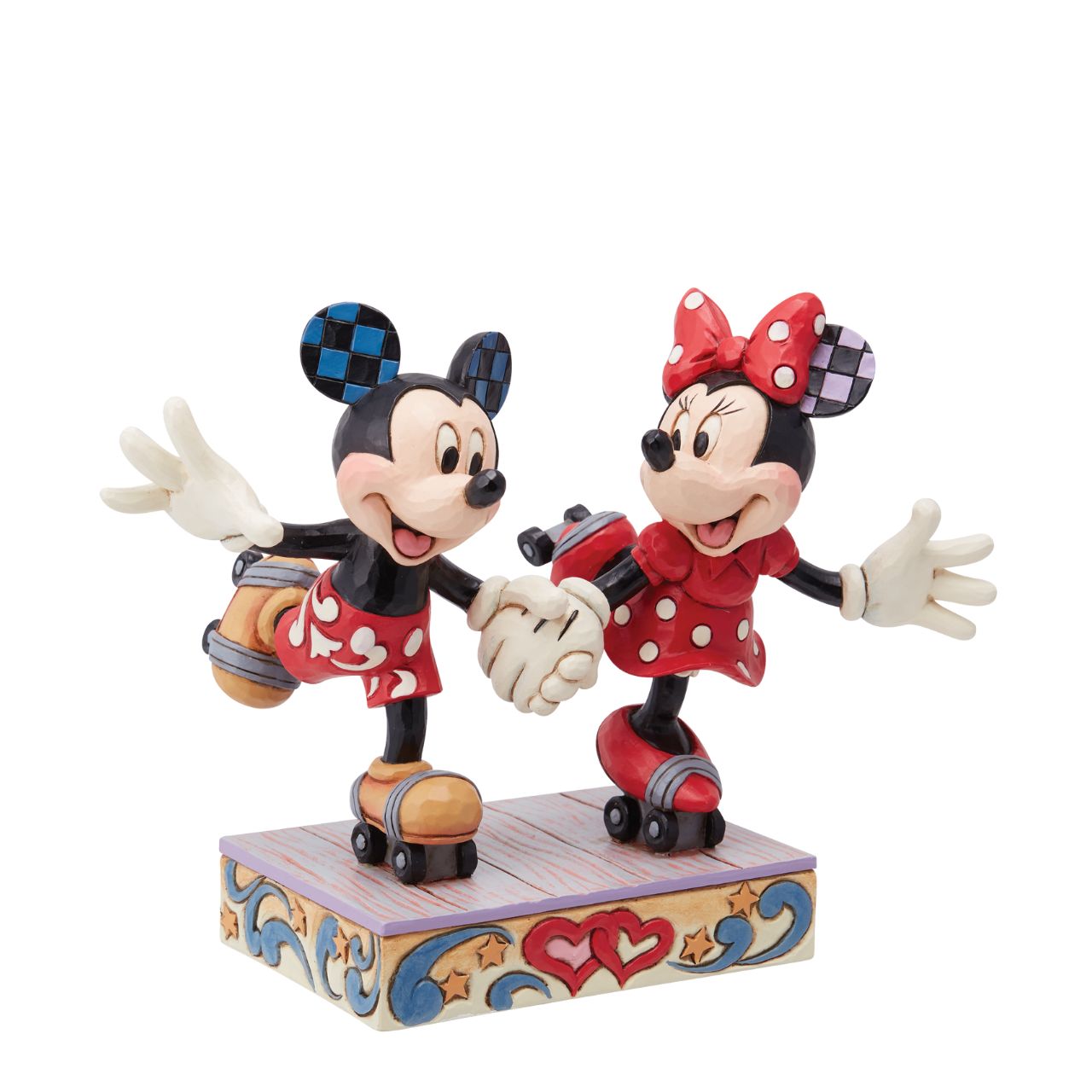 Introducing the newest addition to the Disney Traditions collection by Jim Shore - the Mickey and Minnie Mouse Roller Skating figurine] With exquisite attention to detail and impeccable craftsmanship, this high-quality piece is a must-have for any Disney fan and collector. Mickey and Minnie Mouse are arguably the most iconic couple in the Disney universe, and this figurine captures them in their element - roller skating together hand in hand.