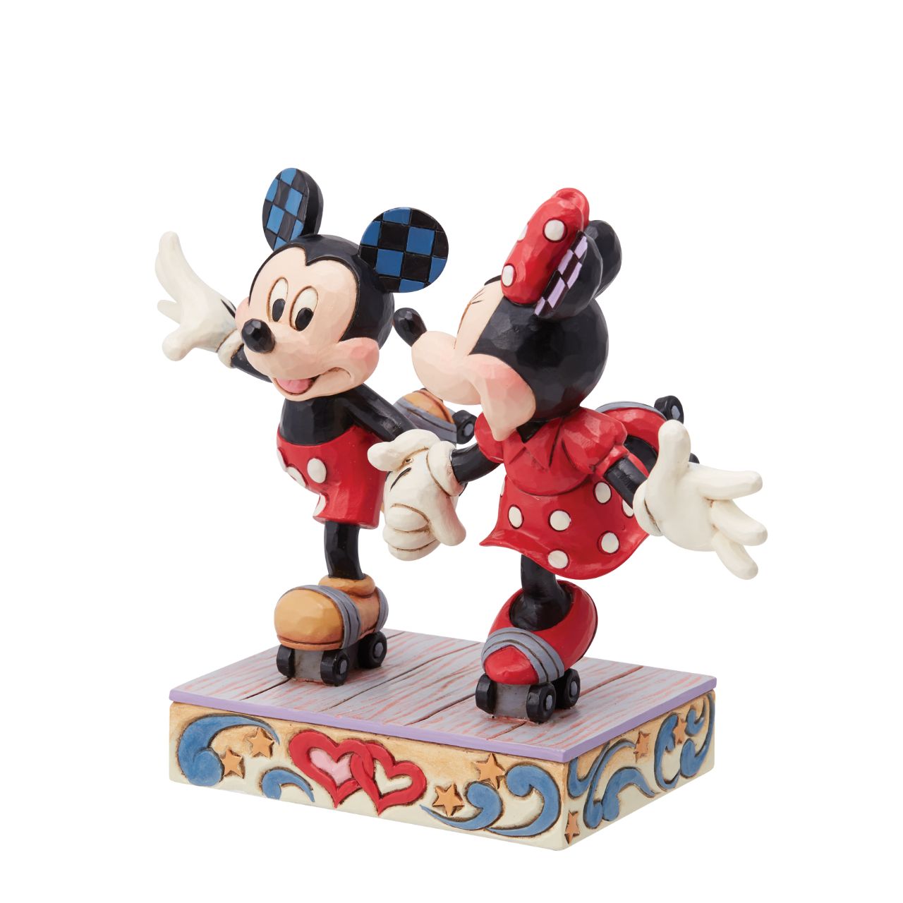 Introducing the newest addition to the Disney Traditions collection by Jim Shore - the Mickey and Minnie Mouse Roller Skating figurine] With exquisite attention to detail and impeccable craftsmanship, this high-quality piece is a must-have for any Disney fan and collector. Mickey and Minnie Mouse are arguably the most iconic couple in the Disney universe, and this figurine captures them in their element - roller skating together hand in hand.