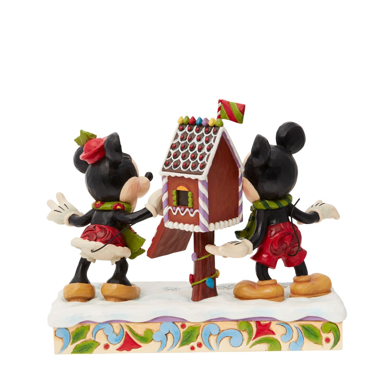 Mickey & Minnie Mouse are in the Christmas Spirit with Disney Traditions by Jim Shore. A beautiful, festive figurine featuring the iconic couple posting their Christmas letter off to Santa. Hand carved and hand painted. Comes in a fully branded gift box.