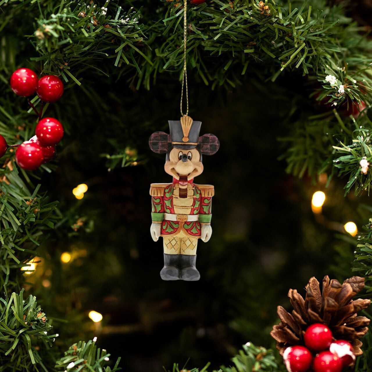 Mickey Mouse is ready to make his debut in the Christmas classic, The Nutcracker. Handcrafted and hand-painted, this timeless ornament features Jim Shore's signature folk art motifs and playful use of colour. 