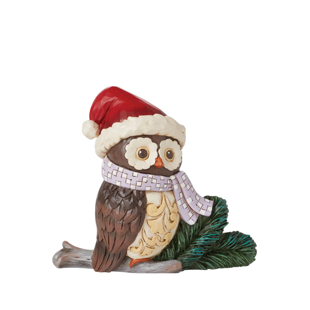 This miniature owl figurine wears a patchwork blue scarf with a Santa hat. With wide eyes and sweet expression, the little owl perches near pine needles with a rosemaling bust. This charming Jim Shore figurine is sure to make your holidays a hoot!