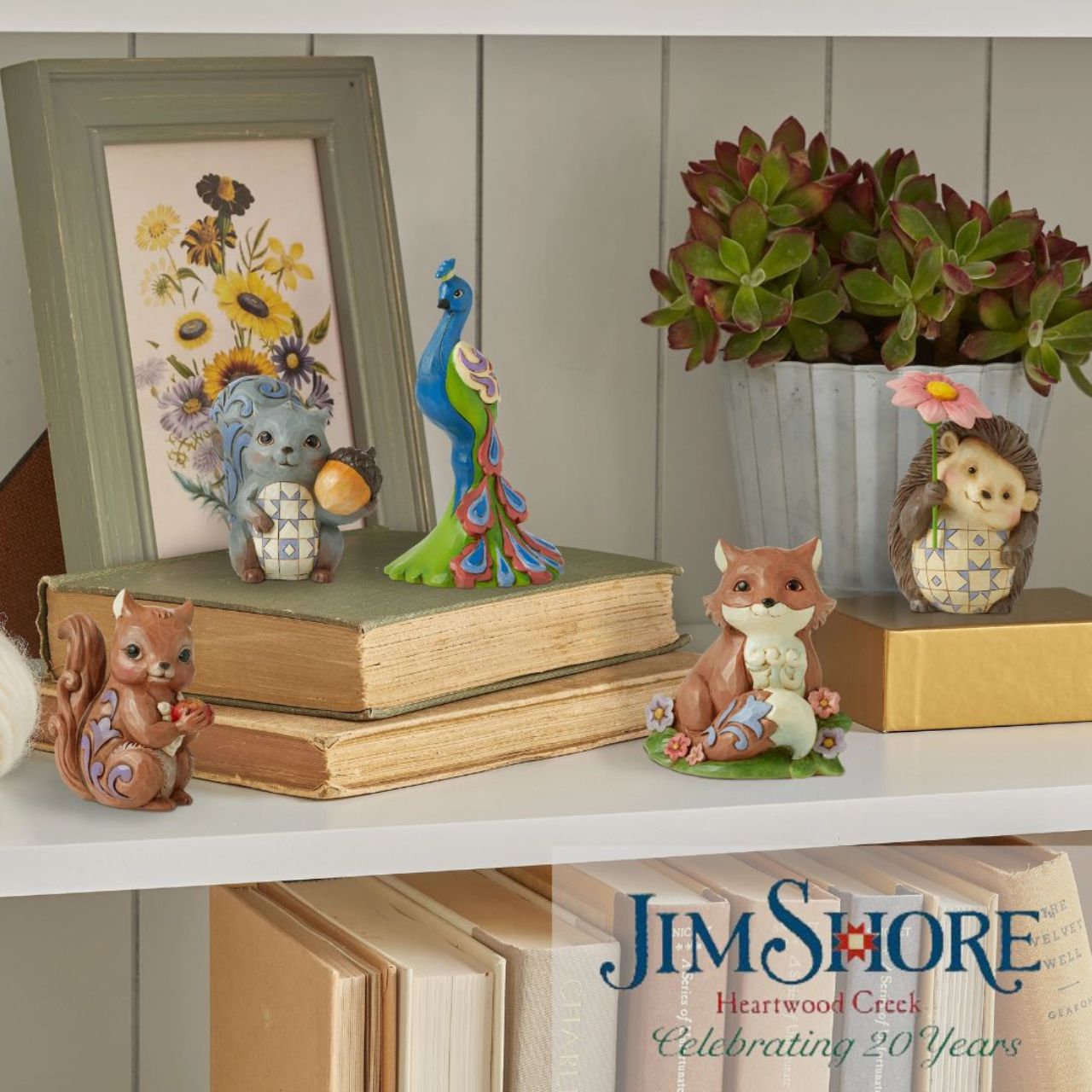 Peacock Mini Figurine by Jim Shore  Handcrafted in breath-taking detail, this delightful Peacock Mini Figurine is beautifully decorated in Jim Shore's subtle combination of traditional quilt. These charming friends of the animal kingdom bring a small dose of delight into your home with sweet dispositions and delicate craftsmanship.