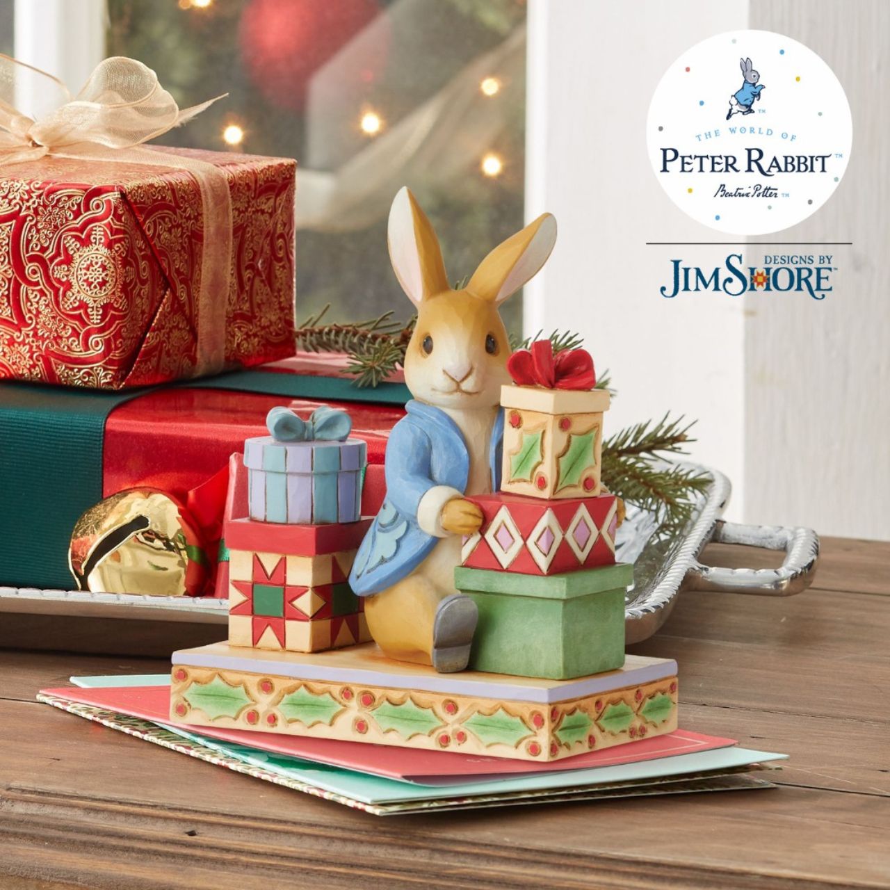 Celebrates Peter Rabbit's 120th anniversary. Jim Shore celebrates Beatrix Potter's lovable cast of characters with charming craftsmanship. This endearing figurine features the esteemed Peter Rabbit on Christmas day surrounded by handsomely packaged presents.