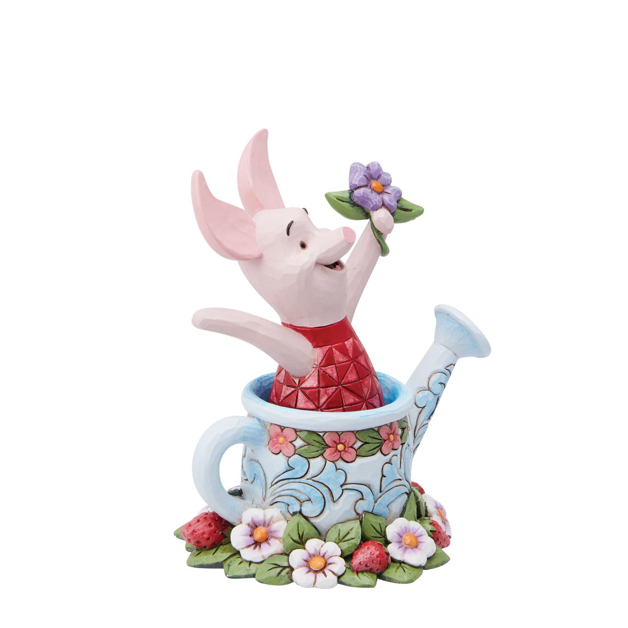 Piglet in a Watering Can Figurine  Introducing the delightful Piglet in a Watering Can Figurine from Disney Traditions by Jim Shore. Dressed in his signature pink jumper, this lovable character is holding a beautiful, pastel purple flower in his hand. This charming figurine is whimsical and heart-warming, bringing joy and magic to any collection of Disney figurines.