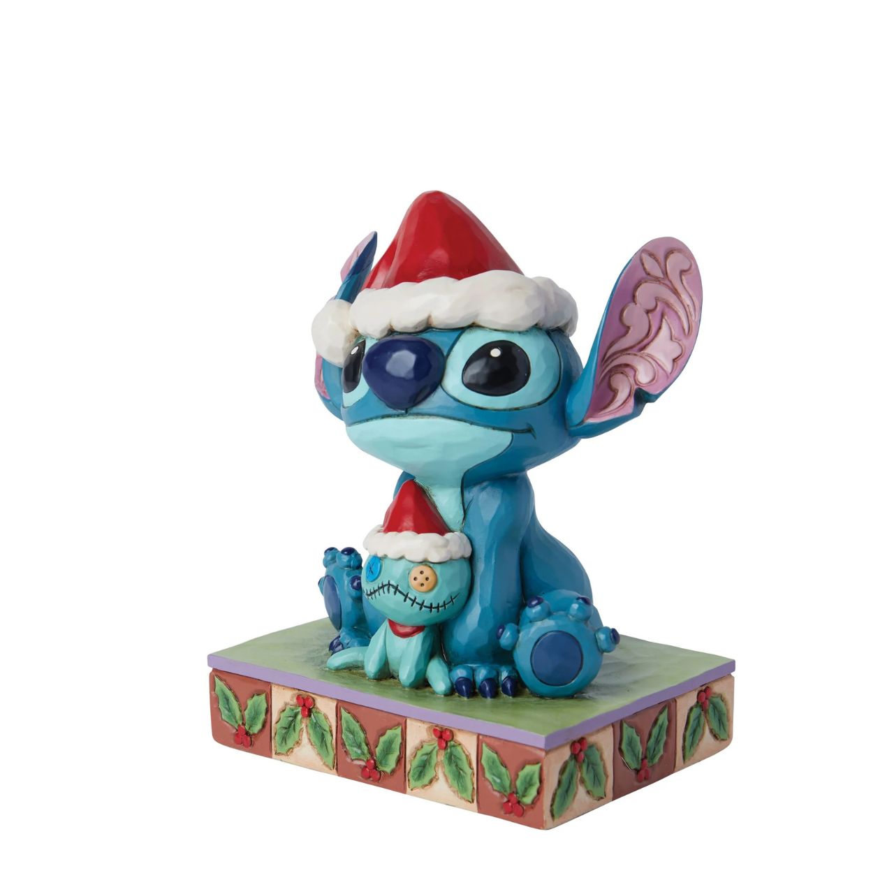 Stitch and his little friend Scrump are all ready for Santa with their festive hats. The perfect addition to any Christmas display from Disney Traditions. Comes in a fully branded gift box.