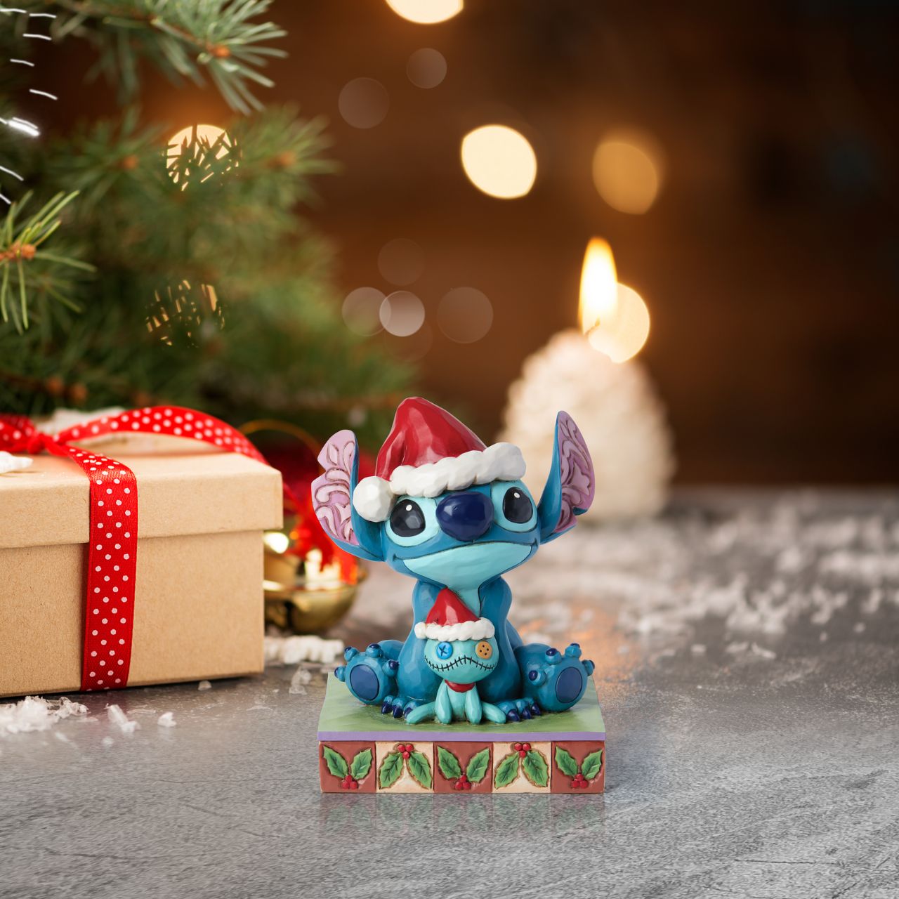 Stitch and his little friend Scrump are all ready for Santa with their festive hats. The perfect addition to any Christmas display from Disney Traditions. Comes in a fully branded gift box.