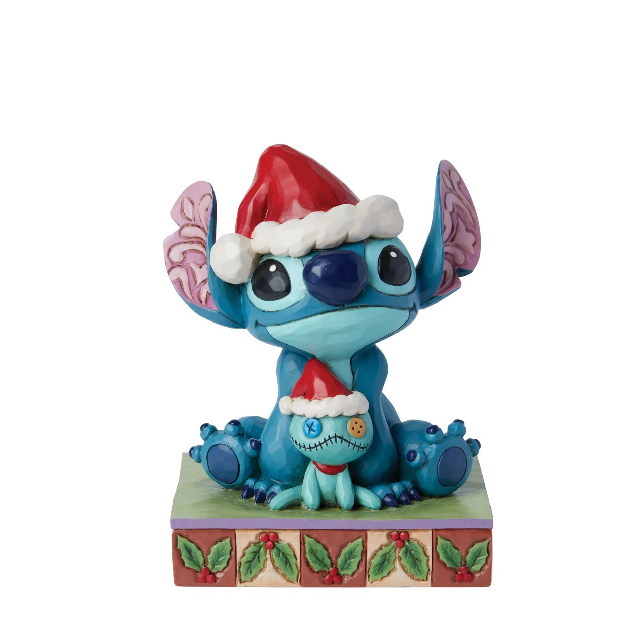 Stitch and his little friend Scrump are all ready for Santa with their festive hats. The perfect addition to any Christmas display from Disney Traditions. Comes in a fully branded gift box.