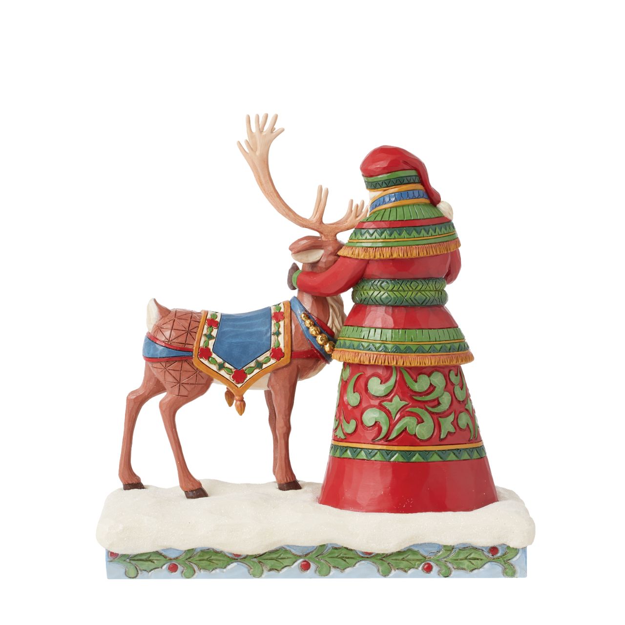 Hand painted and hand crafted from high quality cast stone, this figurine of Santa with his Reindeer helper is the perfect addition to any Christmas display. Part of the Heartwood Creek collection by Jim Shore. Comes in fully branded packaging.