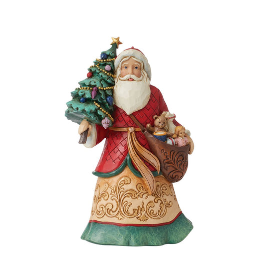 Santa with Tree Figurine  Designed by award winning artist Jim Shore as part of the Heartwood Creek Christmas Collection, hand crafted using high quality cast stone and hand painted, this Santa with Tree is perfect for the Christmas season.