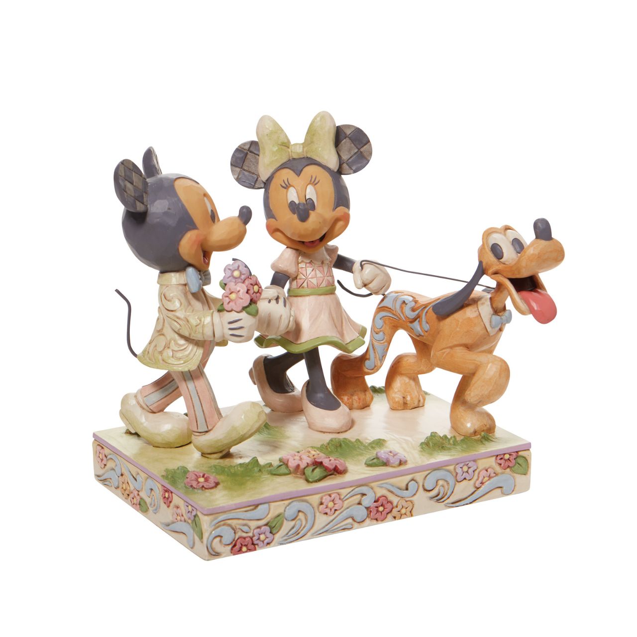 Walt Disney's original couple, Mickey and Minnie Mouse, stroll through the park hand in hand in this lovely Jim Shore piece. With love in the spring air, Mickey hands his wife a bouquet of fresh flowers as their playful pup, Pluto, amuses himself.