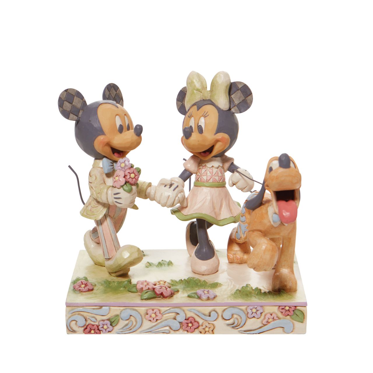 Walt Disney's original couple, Mickey and Minnie Mouse, stroll through the park hand in hand in this lovely Jim Shore piece. With love in the spring air, Mickey hands his wife a bouquet of fresh flowers as their playful pup, Pluto, amuses himself.