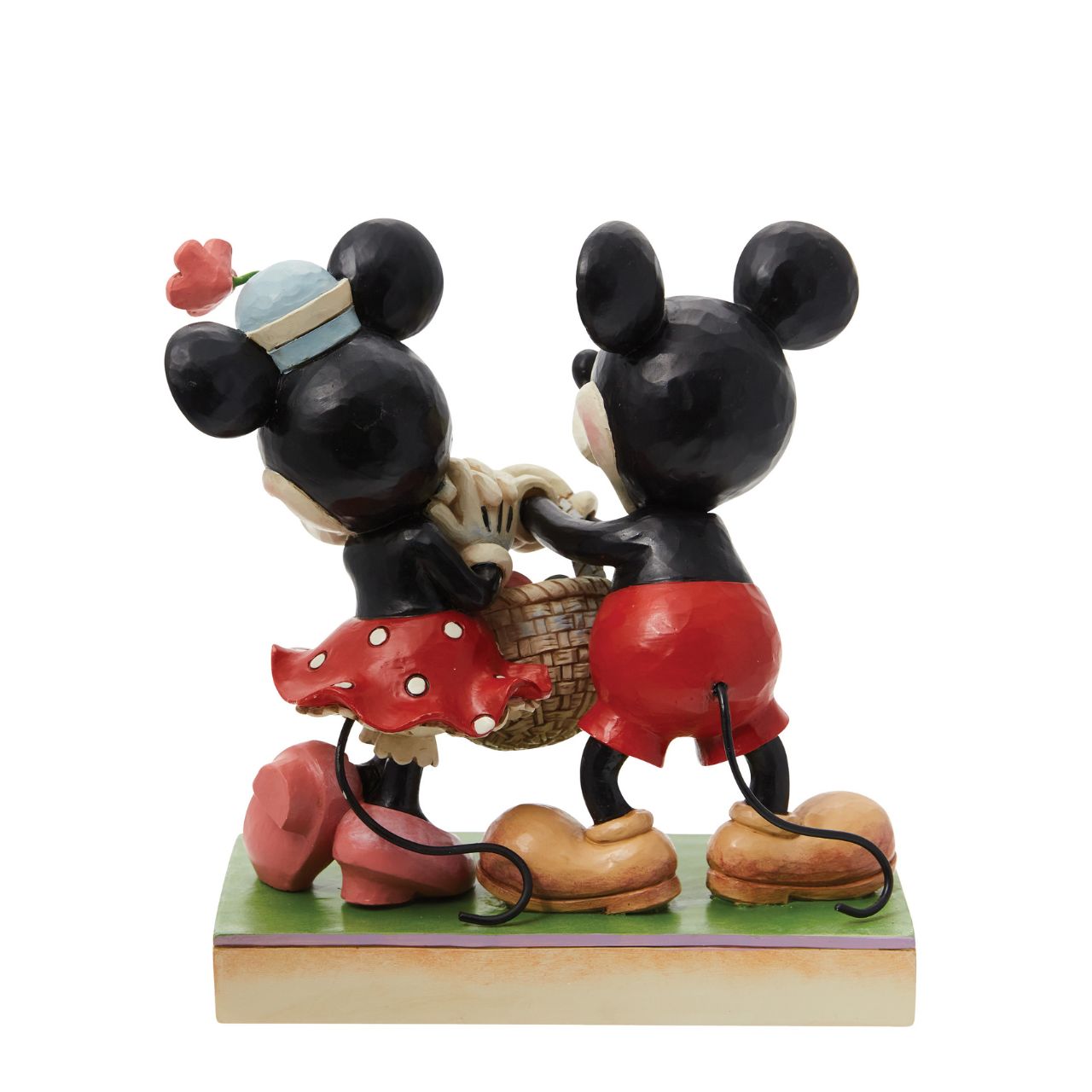 Celebrate the magic of Easter with the vintage-style Mickey and Minnie Mouse figurine from Disney Traditions by Jim Shore. These "Springtime Sweethearts" are depicted holding an Easter basket filled with vibrant coloured eggs, capturing the essence of springtime traditions.