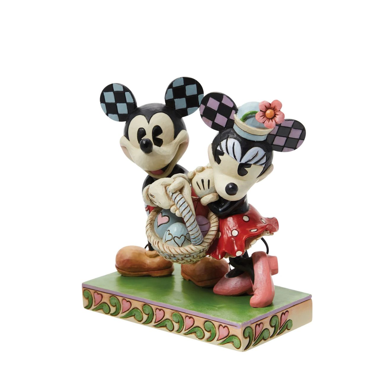 Celebrate the magic of Easter with the vintage-style Mickey and Minnie Mouse figurine from Disney Traditions by Jim Shore. These "Springtime Sweethearts" are depicted holding an Easter basket filled with vibrant coloured eggs, capturing the essence of springtime traditions.