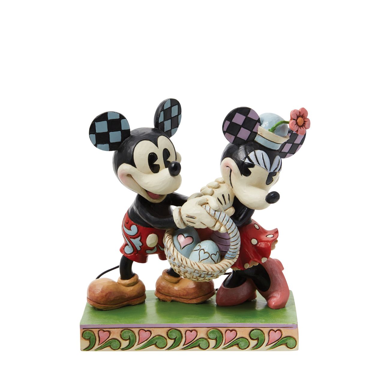 Celebrate the magic of Easter with the vintage-style Mickey and Minnie Mouse figurine from Disney Traditions by Jim Shore. These "Springtime Sweethearts" are depicted holding an Easter basket filled with vibrant coloured eggs, capturing the essence of springtime traditions.