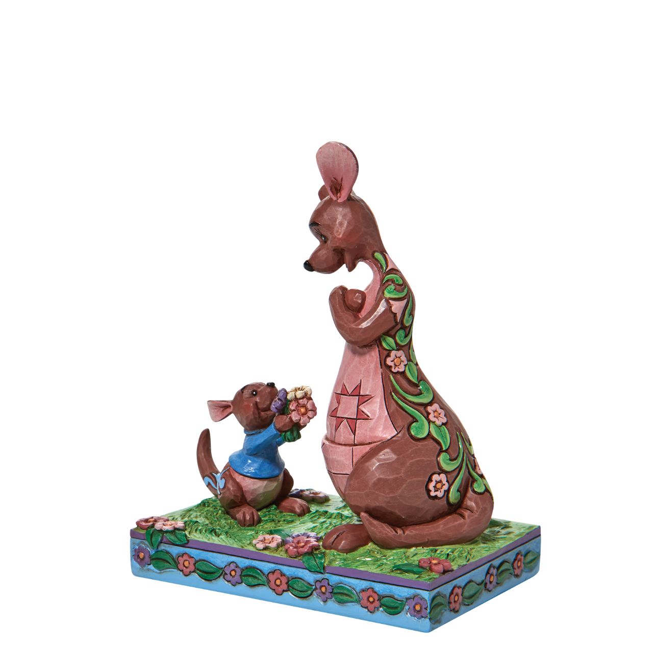 "The Sweetest Gift" The Winnie the Pooh crew enjoy Spring in the Hundred Acre Wood. Kanga and Roo pick wild flowers in the crisp morning air. Engraved with flowers and patchwork, the Jim Shore modelled kangaroo accepts her joey's freshly picked gift with a smile.