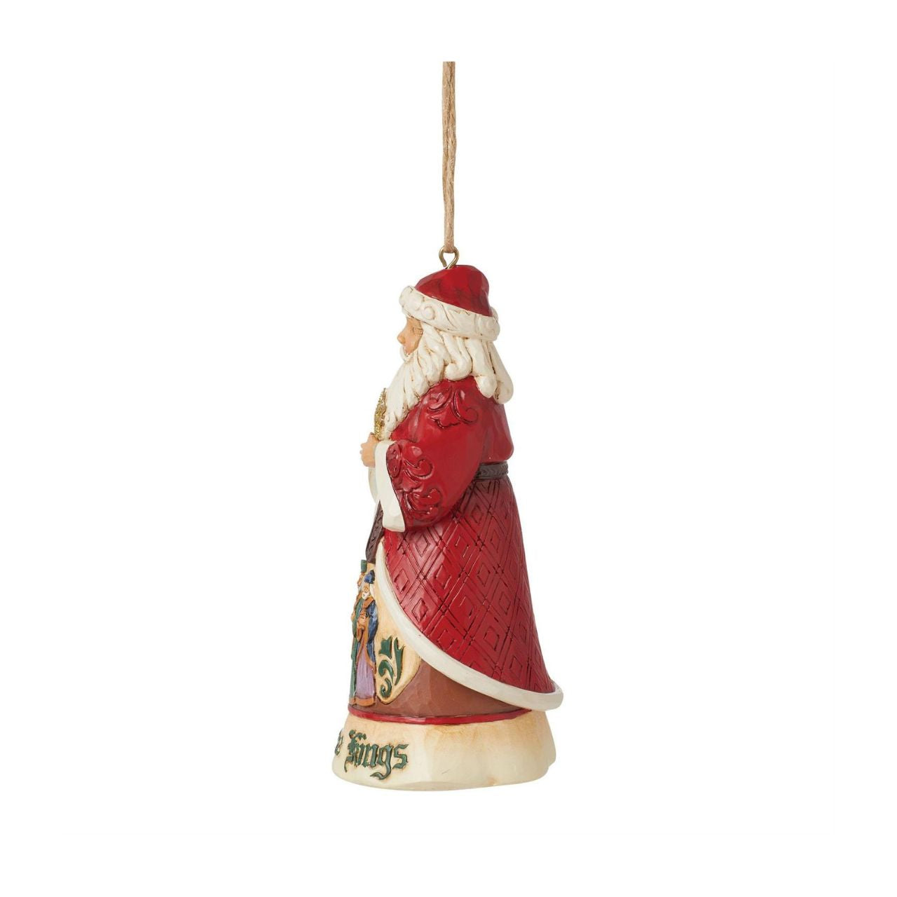 This 17th Annual Santa ornament by Jim Shore is of a series honouring Christmas songs. Three lavishly dressed kings create a colourful manger scene on Santa's robes. Santa sings along to We Three Kings emphatically, hands in gesturing in his ornate coat.