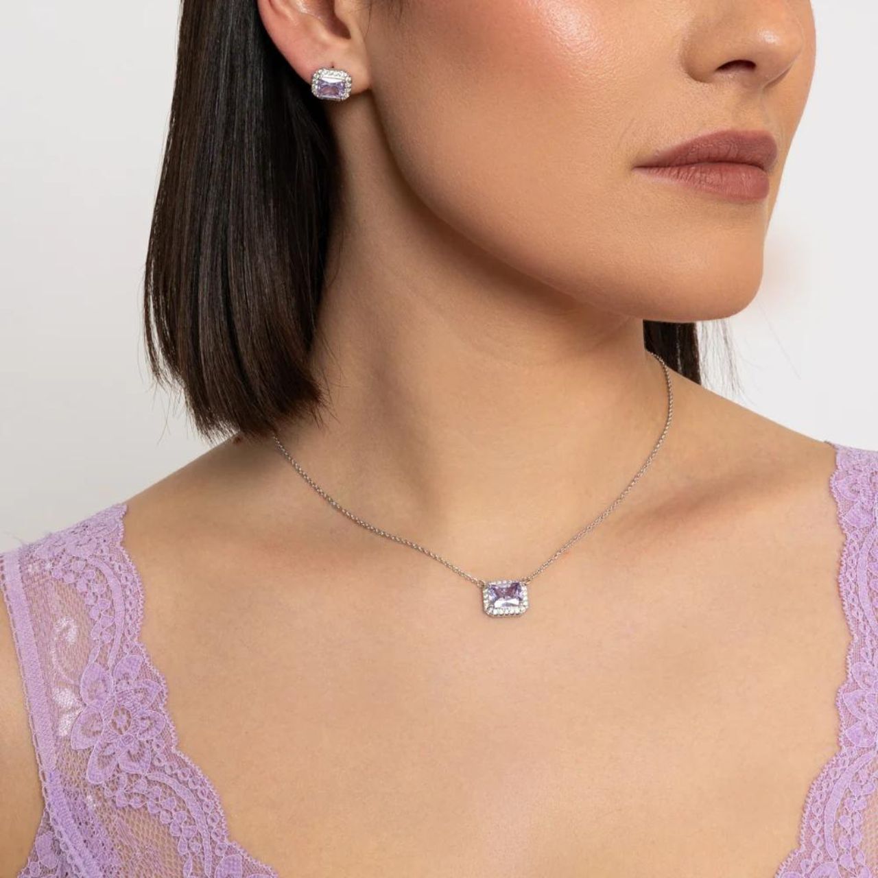 Enhance your outfit with the Knight & Day Horizontal Lavender CZ Necklace. Made with silver plating and featuring a stunning lavender CZ stone, this necklace adds a touch of elegance and sophistication to any look. Perfect for any occasion, this necklace is a must-have for any jewellery collection.