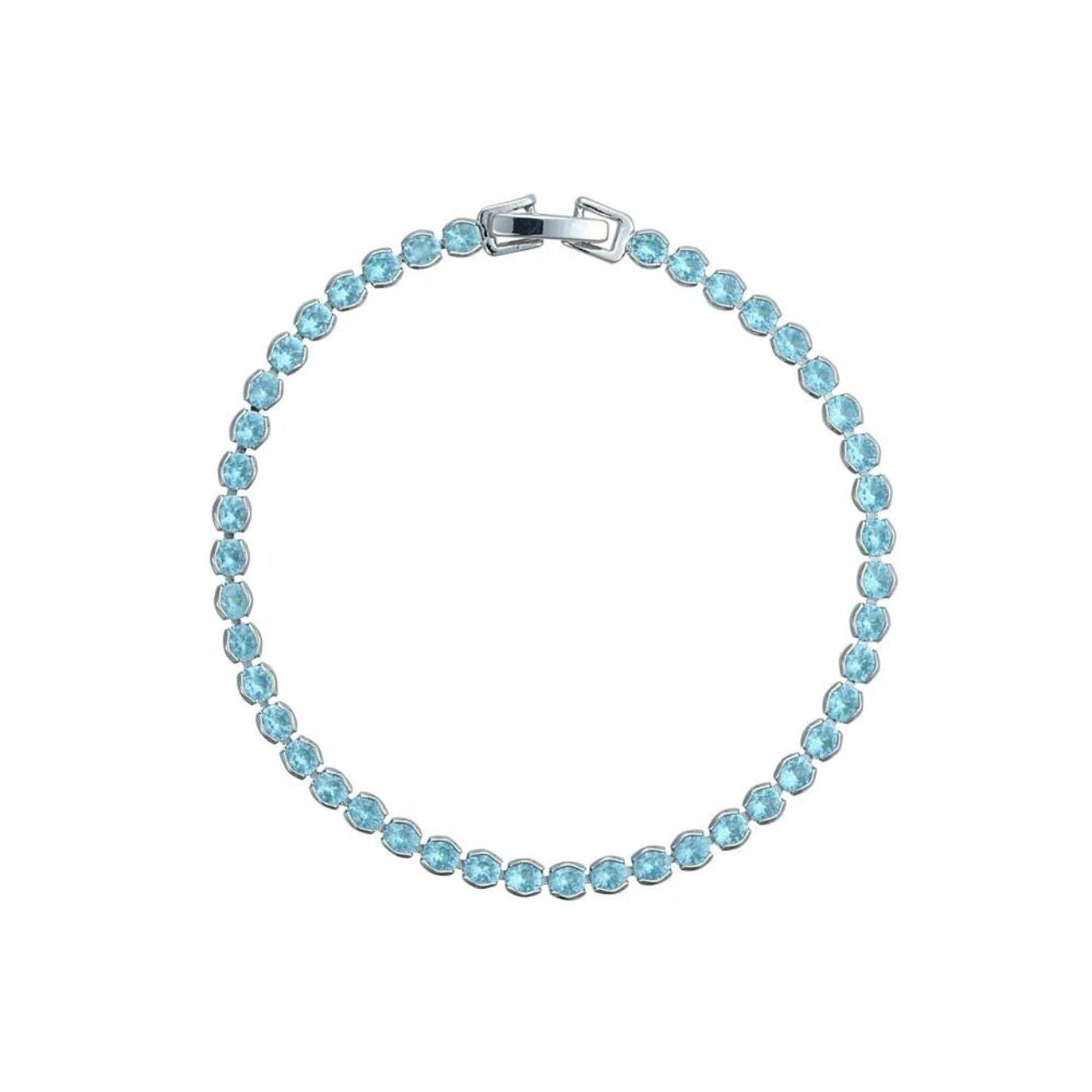 Miniature rhodium plated tennis bracelet with Light Blue CZ stones. Elegant when worn alone and also ideal for layering with watch or other bracelets. Fold over clip fastening.