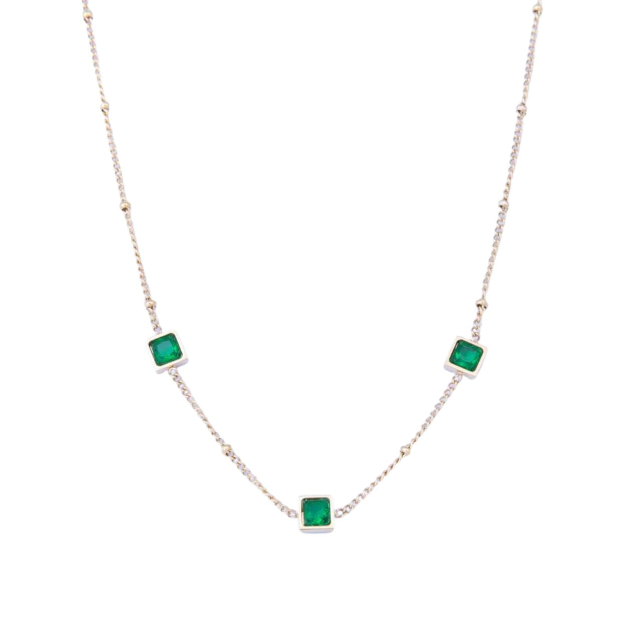 Leilani Emerald Necklace by Knight & Day   The Knight & Day Leilani Emerald Necklace is plated with luxurious 14K yellow gold for a stylish yet timeless look. The lustrous green stones provide a radiant contrast and create a striking statement piece.