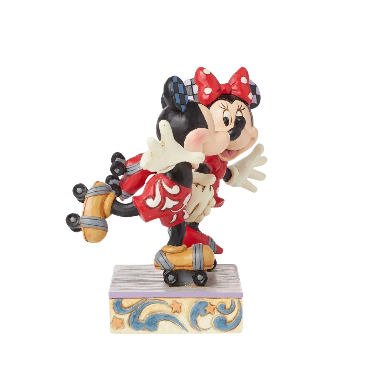 Introducing the newest addition to the Disney Traditions collection by Jim Shore - the Mickey and Minnie Mouse Roller Skating figurine] With exquisite attention to detail and impeccable craftsmanship, this high-quality piece is a must-have for any Disney fan and collector. Mickey and Minnie Mouse are arguably the most iconic couple in the Disney universe, and this figurine captures them in their element - roller skating together hand in hand.