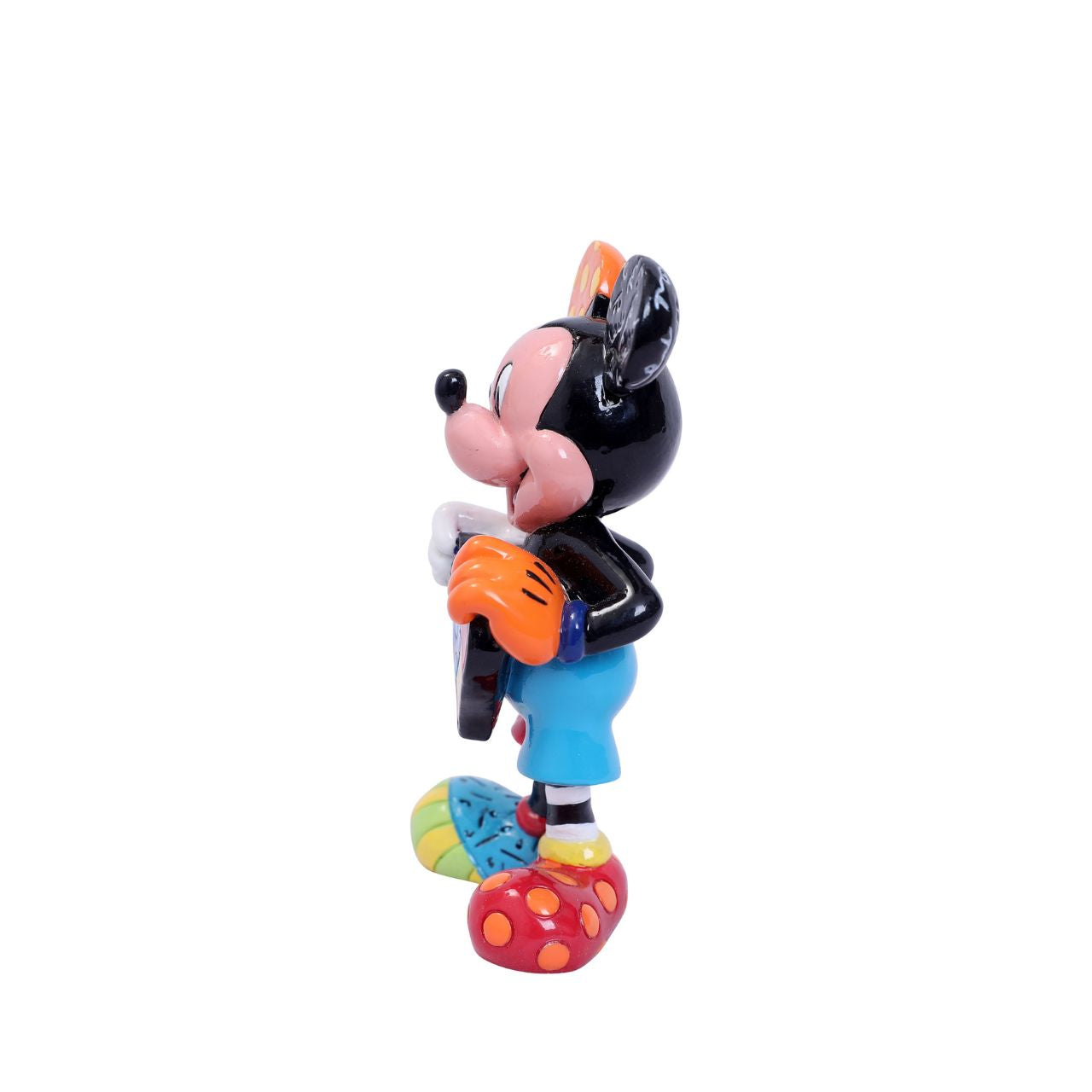 With a joyful smile, Mickey holds out a brightly painted heart to his beloved Minnie. Mickey is rocking a gloriously diverse palette, thanks to a unique paint job by Romero Britto, a multi-talented Brazilian pop artist known for his vibrant colours.