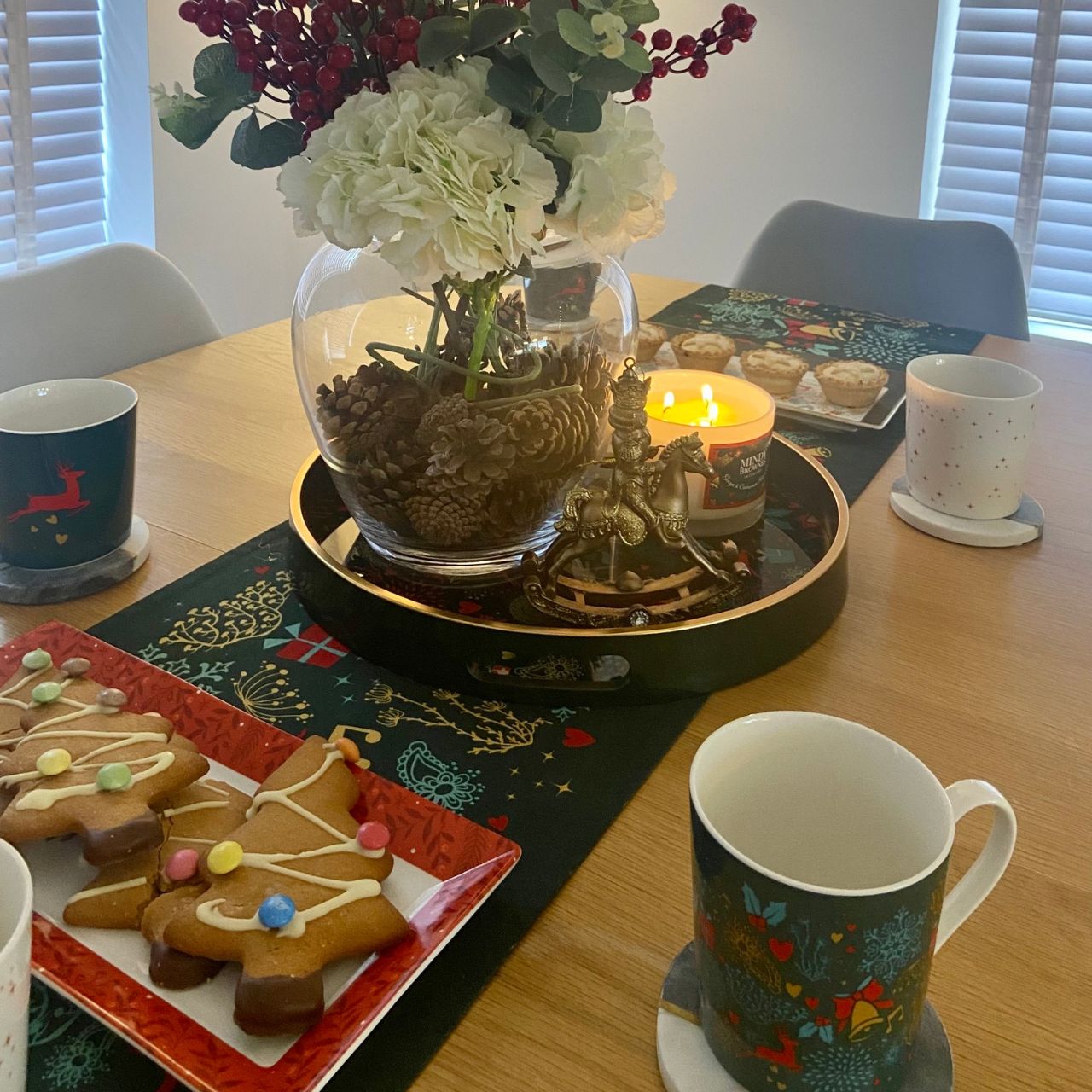 A Christmas Wish Tray by Mindy Brownes Interiors  A stunning circular tray, with a rich green surround, gold rim, and a Christmas design that features some of Christmas' key elements, such as reindeer, presents, music notes and more. An ideal styling accessory this Christmas season.