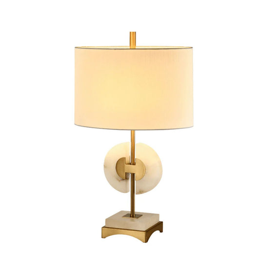 A stunning brass and marble lamp with a white oval shade. Ideal for any area in the home.