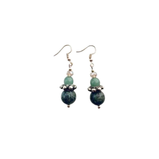 This pair of earrings features African Turquoise gemstones combined with Aventurine gemstones and champagne coloured Crystal, teamed with a decorative Brass ring.