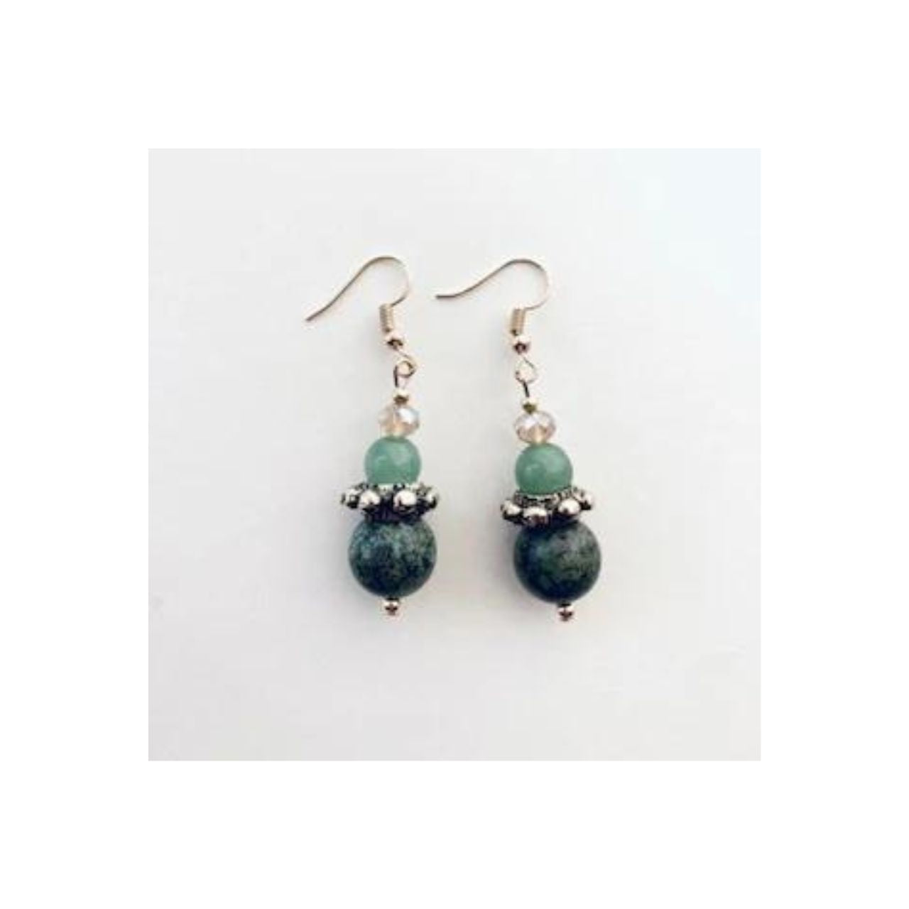 This pair of earrings features African Turquoise gemstones combined with Aventurine gemstones and champagne coloured Crystal, teamed with a decorative Brass ring.