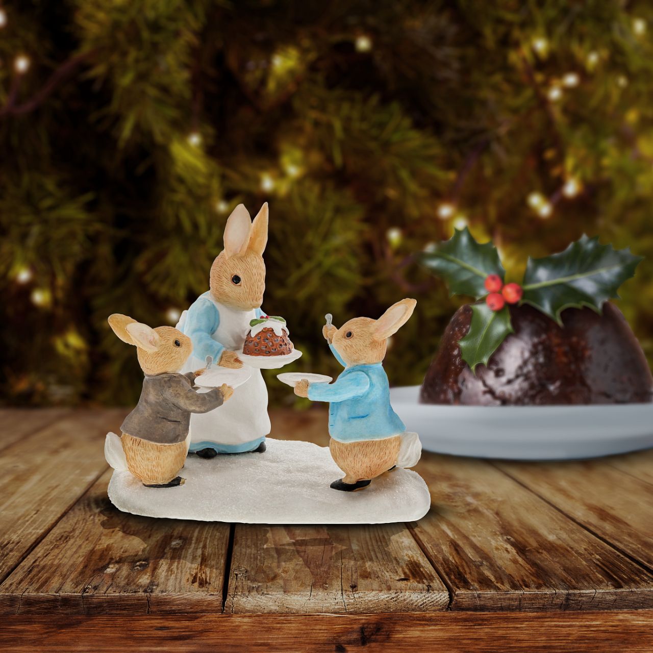 Beatrix Potter Mrs. Rabbit with a Christmas Pudding Figurine  Wish someone a very Merry Christmas with this beautiful, Mrs. Rabbit with a Christmas Pudding Figurine. This charming figurine would make a treasured keepsake over the festive period, and would be take pride of place in your home this Christmas.