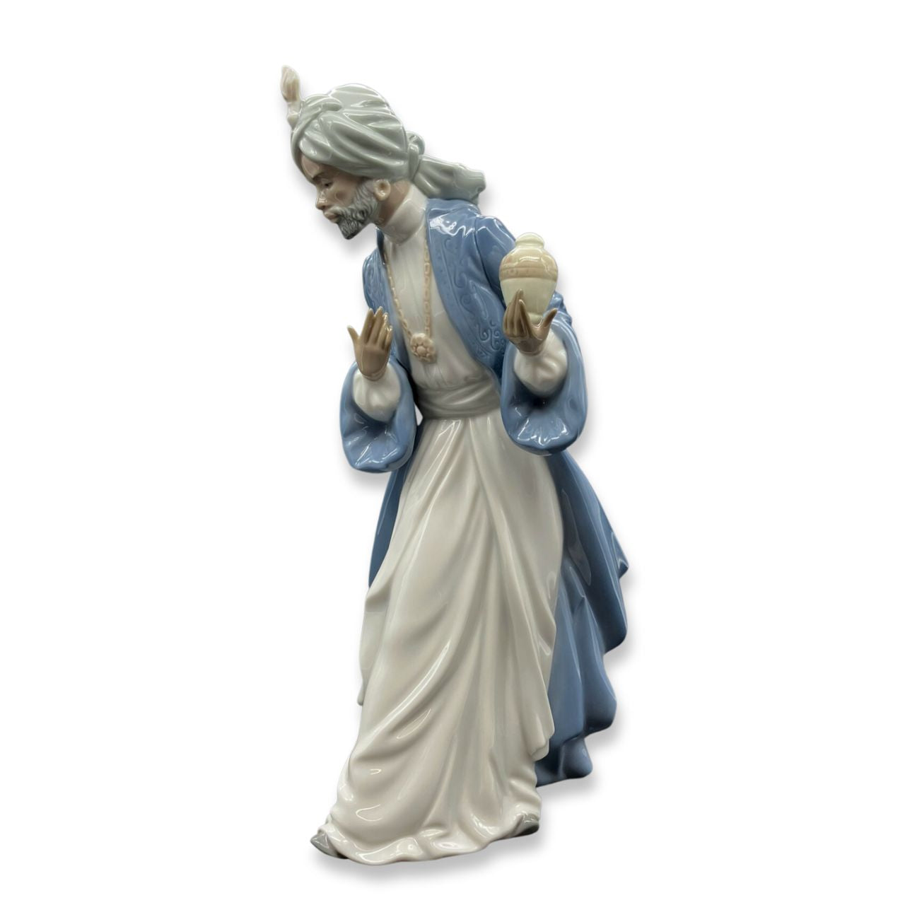 Nao by Lladro King Balthasar with Jug Wisemen  Nao porcelain figurine “King Balthasar with Jug” from the Christmas Collection.  Sculpted by Regino Torrijos, this figurine is part of the nativity set.