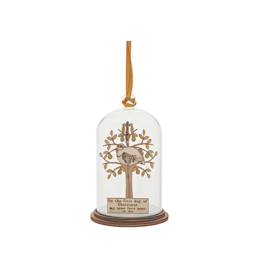 The Spirit of Christmas. A collection of delightful wooden decorations that capture the essence of that special time of year. This glass dome, Christmas decoration encases a Partridge, adorned with a pear tree and ribbon to help hang off your Christmas tree. This classic vintage style, decorative Kloche will make a stunning display in your home.